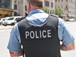 Kid fires distracted cop’s gun in crowded school hallway