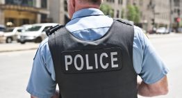 Kid fires distracted cop’s gun in crowded school hallway