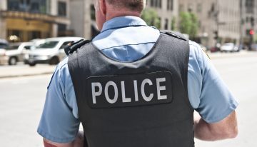 Kid fires distracted cop’s gun in crowded school hallway