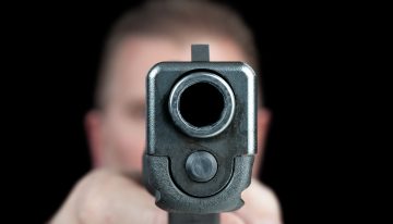 Man dodges headshot from large caliber pistol